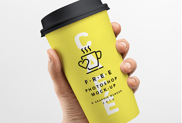 Download Hand Held Coffee Cup PSD Mockup Download Free - DesignHooks
