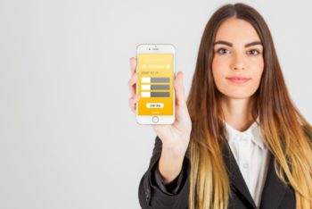 Free Businesswoman Holding Smartphone Mockup