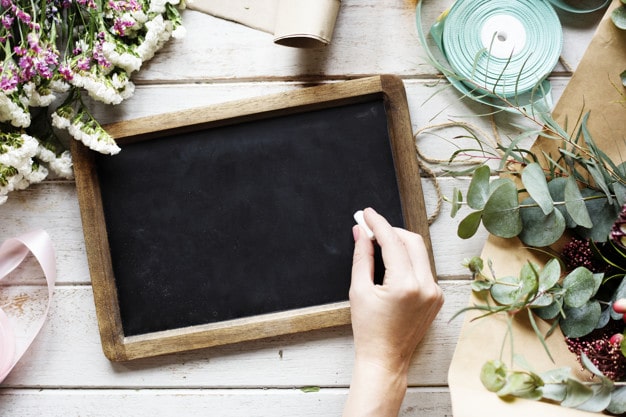 Hand Holding Chalk Plus Slate