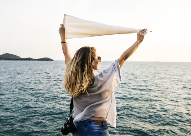 Woman Holding Flag Plus Sea
